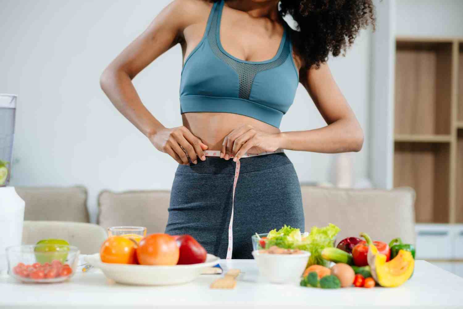 Woman measuring waist while following a healthy 6 week plan Ozempic weight loss results