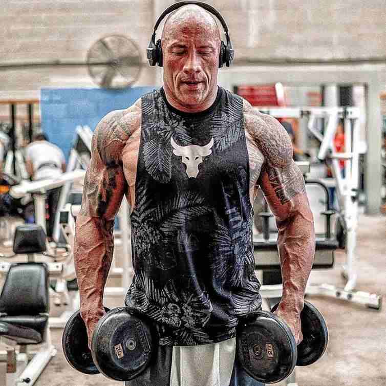 Dwayne Johnson weight loss transformation during an intense gym workout