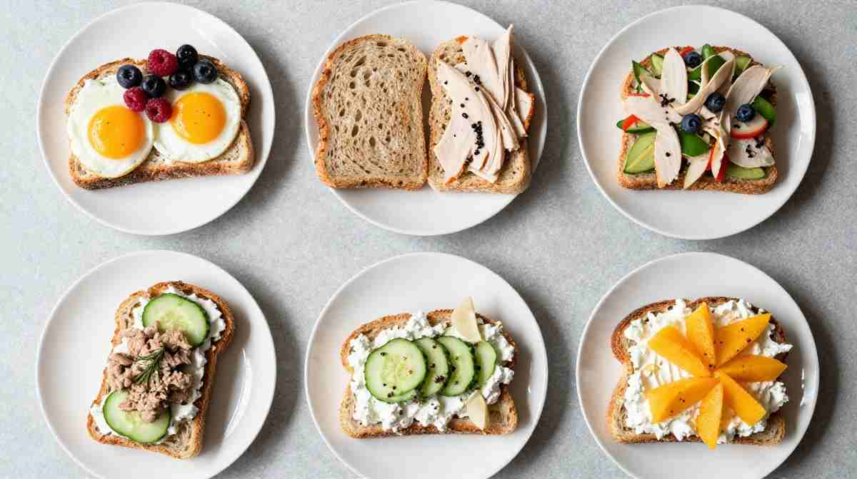 Balanced bread meal with eggs, vegetables, fruit, and whole grains